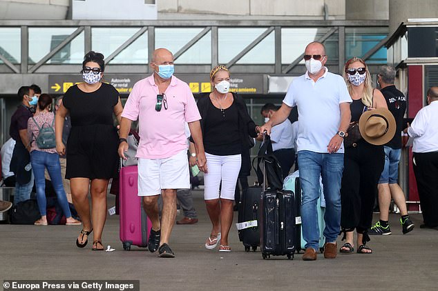British Citizens arrive at the Malaga-Costa del Sol Airport after the UK imposed a quarantine on all travellers from Spain